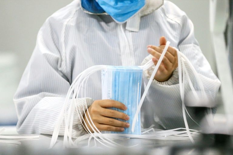 As China needs virus masks, phone and diaper makers fill void